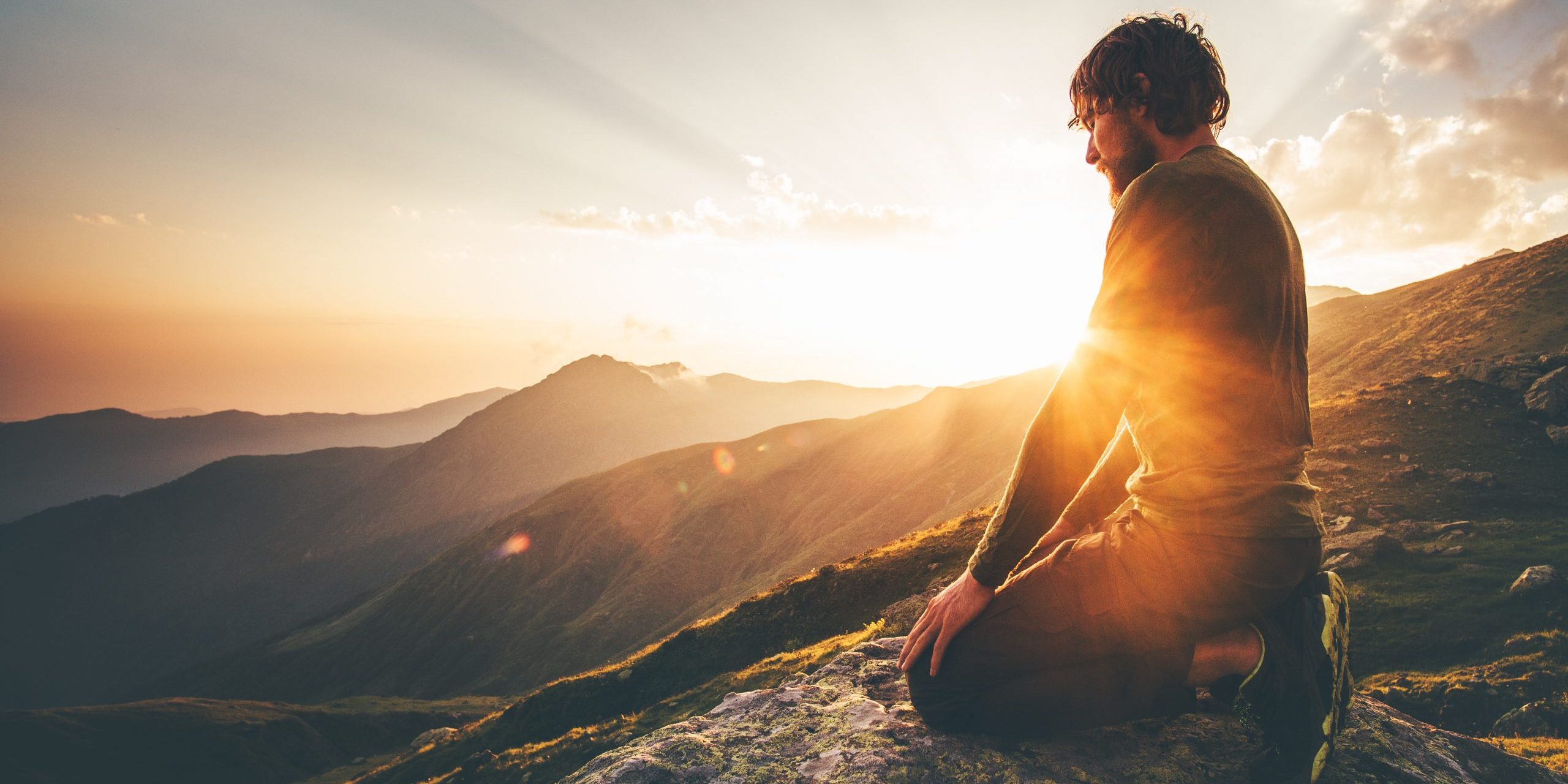 Man relaxing at sunset mountains Travel Lifestyle spiritual awak Man relaxing at sunset mountains Travel Lifestyle spiritual awakening emotional meditating concept vacations outdoor harmony with nature landscape